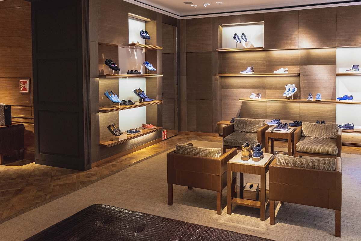 shoe shop tables near shelf rug